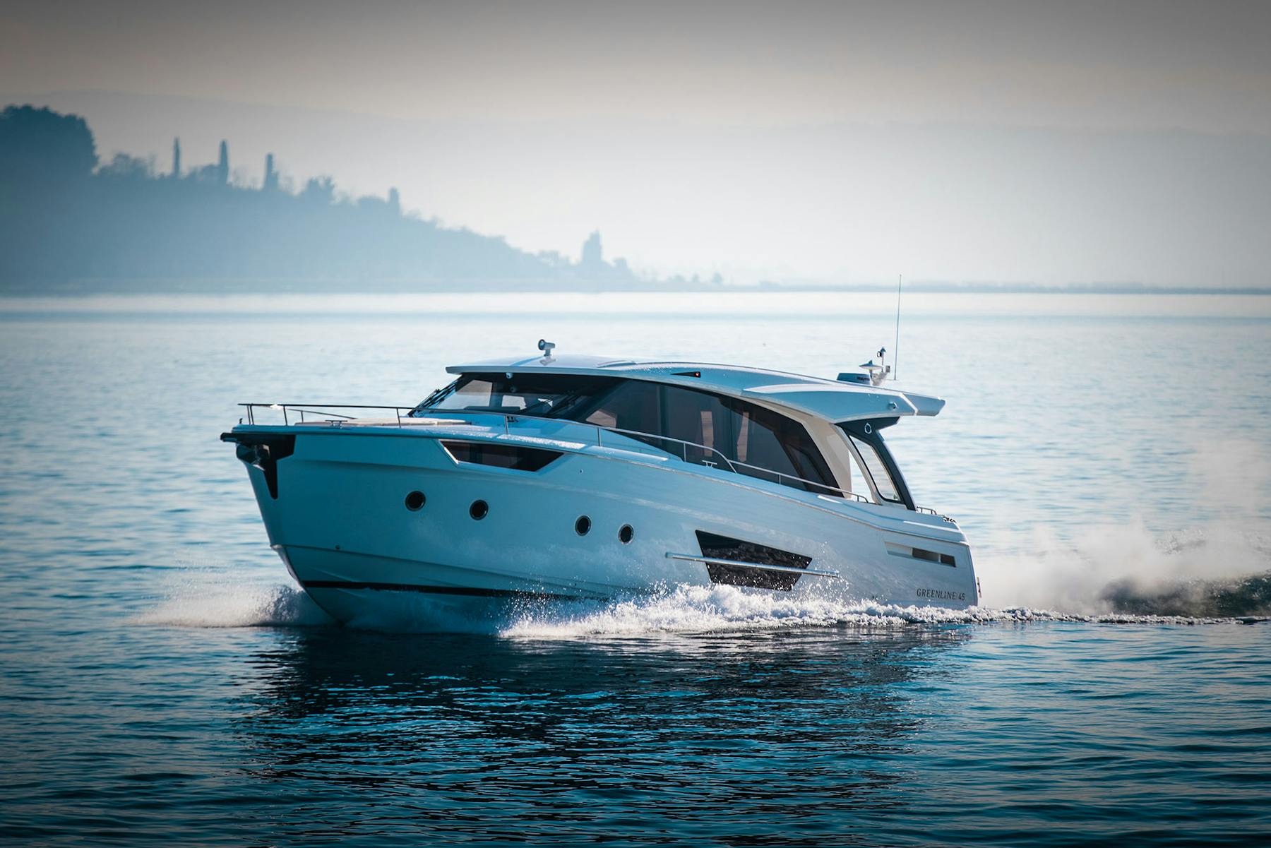 Greenline 45 Coupe underway with the coast beyond